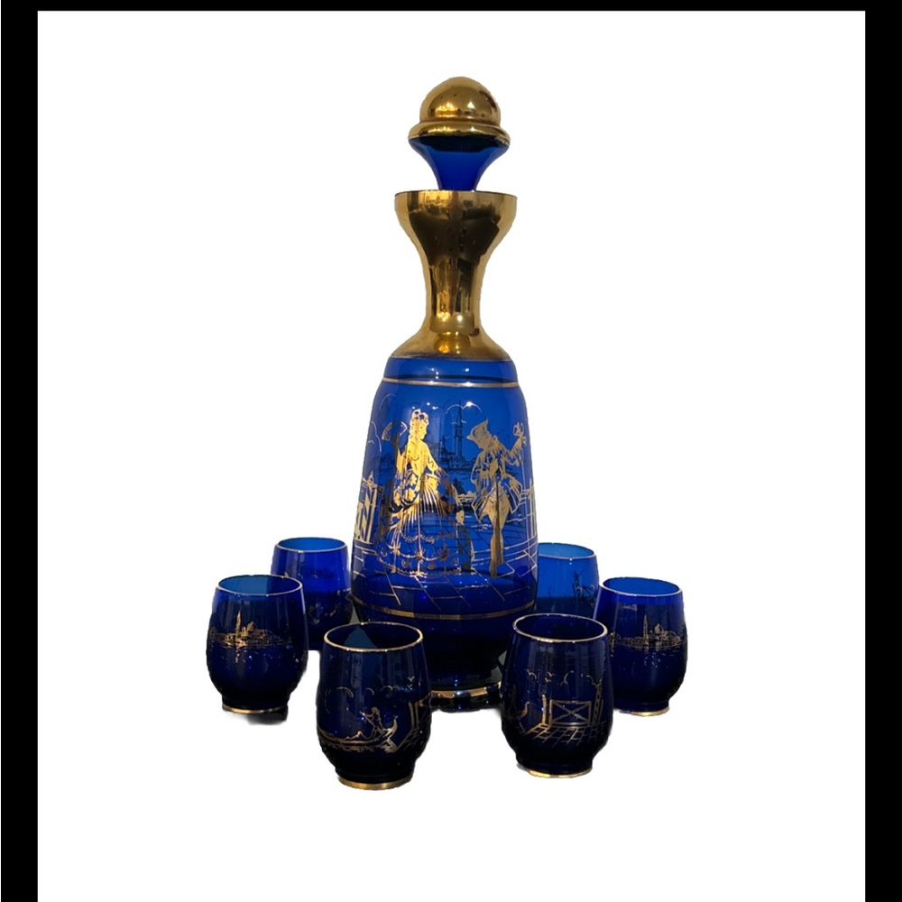 Cobalt blue and gold decanter with 6 cups . Perfect condition and beautiful set